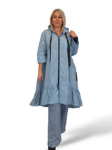 Capa de chuva com folhos