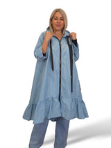 Capa de chuva com folhos