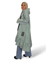 Capa de chuva com folhos