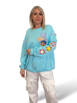 SUDADERA OVERSIZE MANGA FLOR