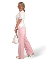 JEANS PATA ANCHA CRUZADO STRASS ROSA