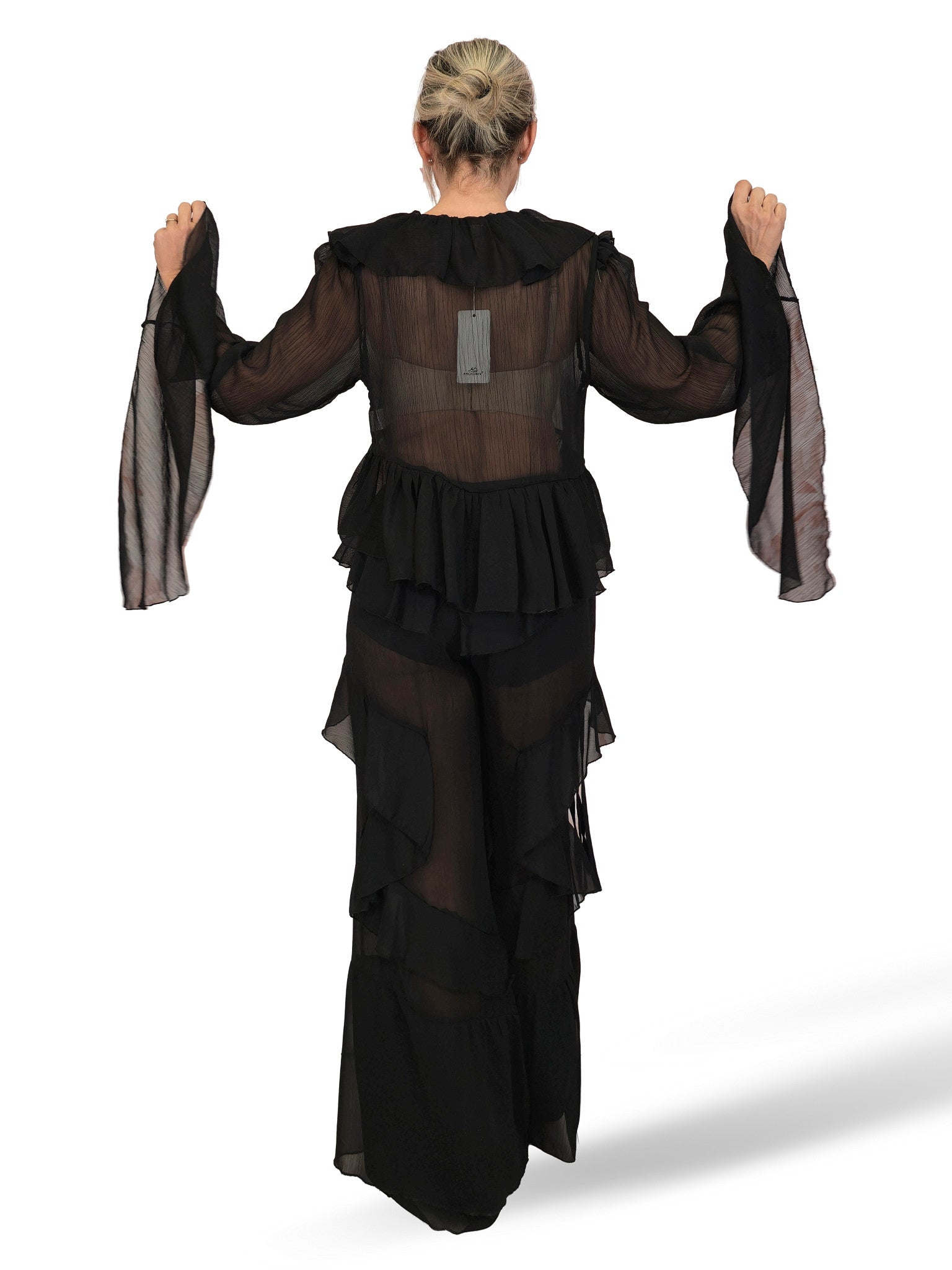 Completo composto da camicetta in chiffon e pantaloni con volant