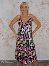 VESTIDO DE PAETÊS COM LETRAS JOT