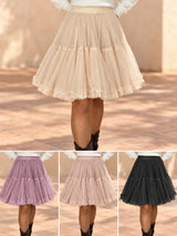Falda corta de tul y volantes en beige, malva, nude y negro